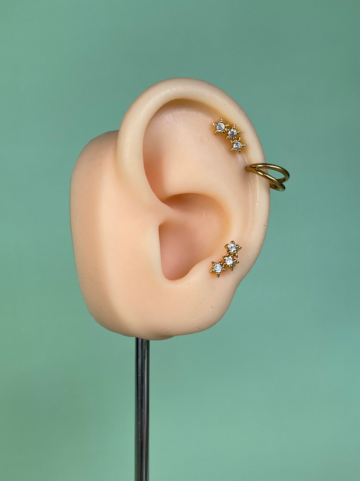 Pendiente/piercing “Triple” dorado